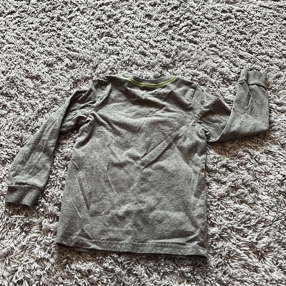 Dinosaur eating popcorn Halloween themed top - Picture 3 of 3